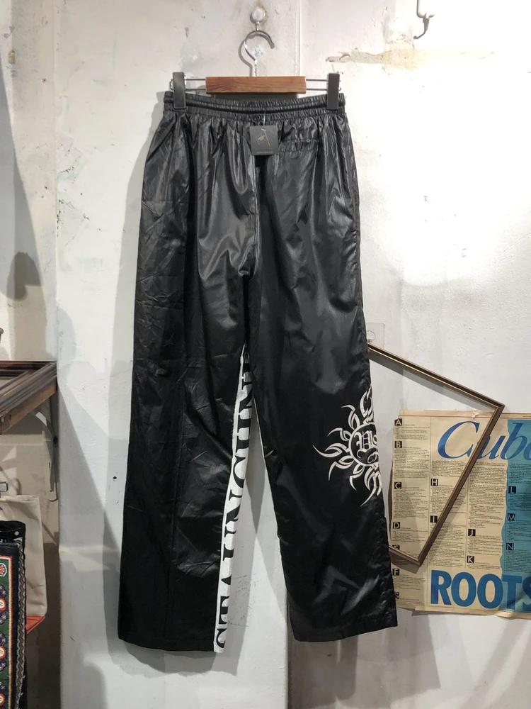 Black leg graphic nylon track pants 4
