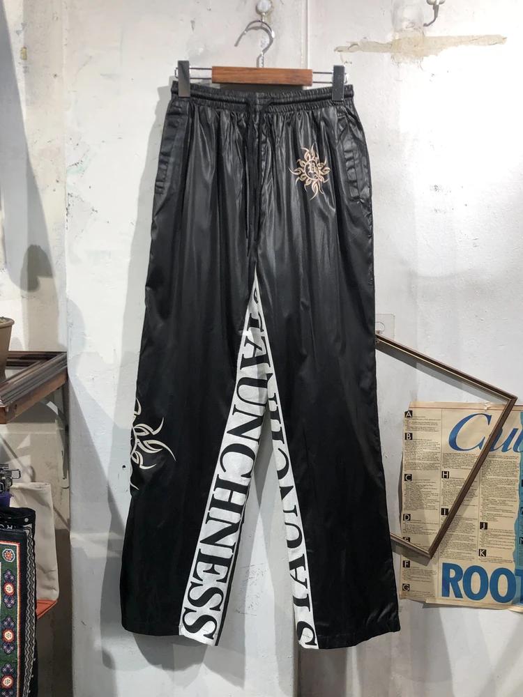 Black leg graphic nylon track pants 3