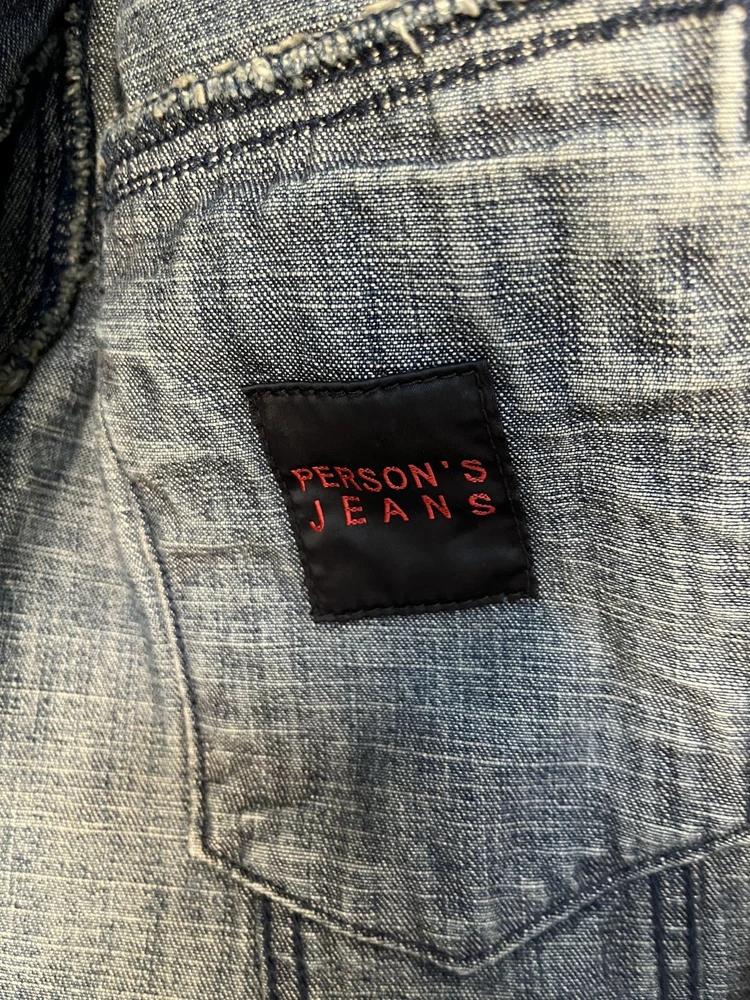 Person's denim jacket 8