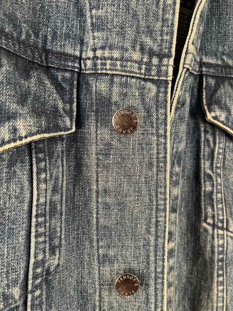Person's denim jacket 6