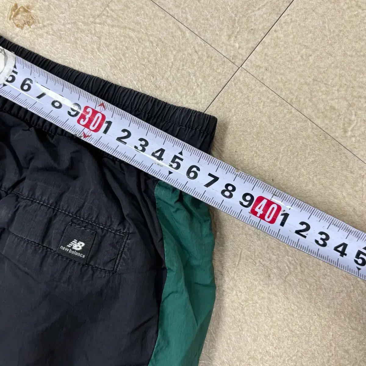 뉴발란스 배색 스몰로고 나일론 트랙 팬츠 7
